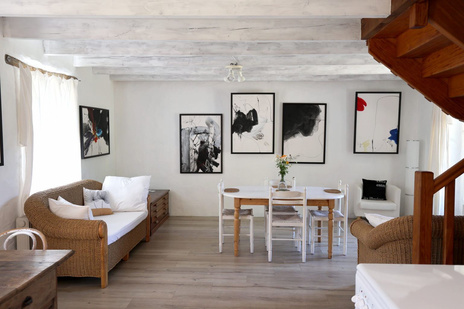 The living room hung with original works